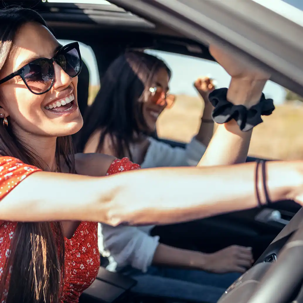 Girls driving in summer